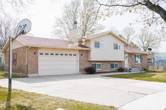 20 E 9n Cir N, American Fork, UT 84003 - tri-level home featuring brick siding, an attached garage, fence, and a chimney