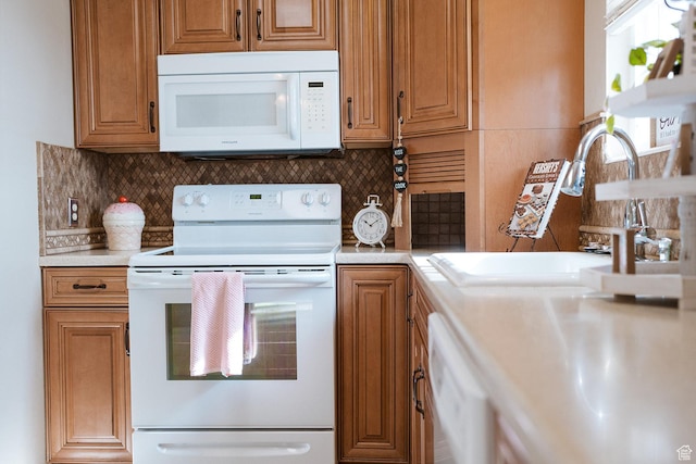 20 E 9n Cir N, American Fork, UT 84003 - kitchen featuring white appliances, brown cabinets, a sink, and decorative backsplash