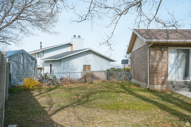 20 E 9n Cir N, American Fork, UT 84003 - back of property with entry steps, fence, a lawn, and a chimney