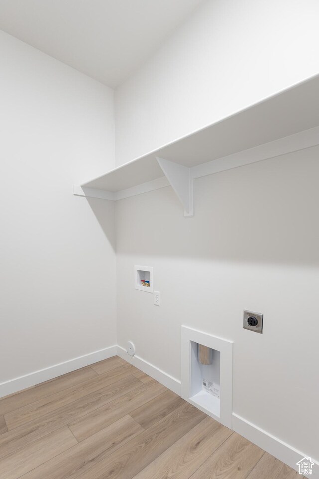 3782 S 4250 W Unit 429C, West Haven, UT 84401 - laundry room featuring hookup for an electric dryer, washer hookup, light wood finished floors, and baseboards