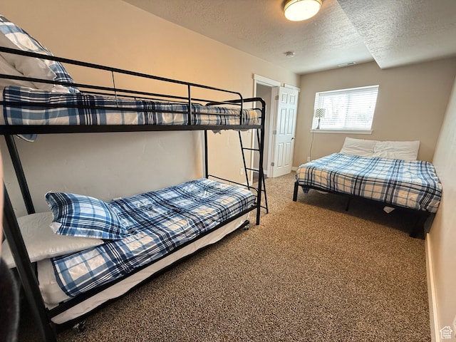 288 W Stuart Dr, Garden City, UT 84028 - carpeted bedroom with visible vents and a textured ceiling