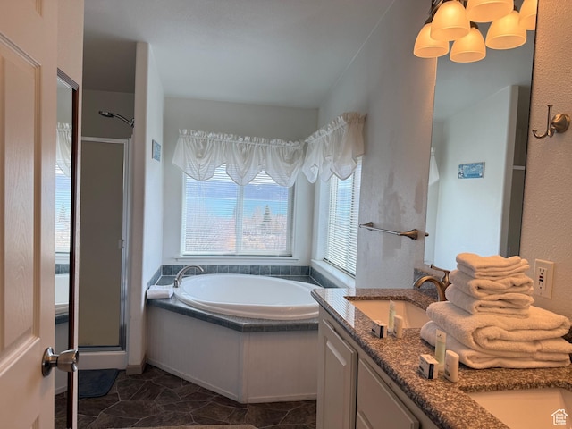 288 W Stuart Dr, Garden City, UT 84028 - full bath featuring a stall shower, a garden tub, double vanity, and a sink