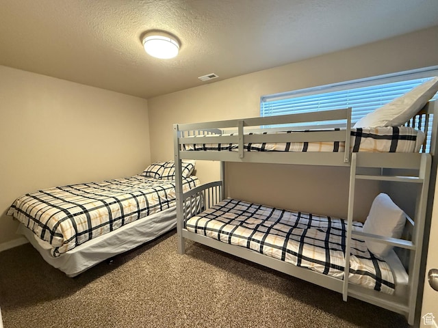 288 W Stuart Dr, Garden City, UT 84028 - carpeted bedroom with a textured ceiling and visible vents