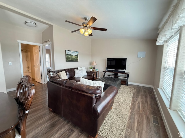 288 W Stuart Dr, Garden City, UT 84028 - living area with dark wood-type flooring, visible vents, baseboards, and ceiling fan