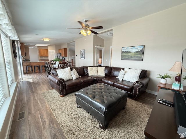 288 W Stuart Dr, Garden City, UT 84028 - living room with visible vents, baseboards, a ceiling fan, wood finished floors, and lofted ceiling