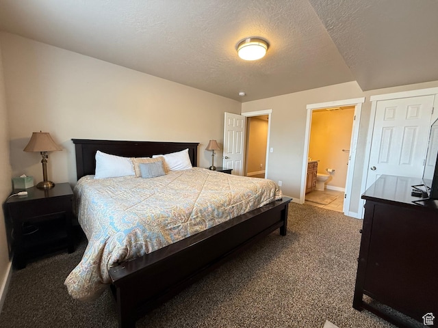 288 W Stuart Dr, Garden City, UT 84028 - bedroom with ensuite bathroom, a textured ceiling, baseboards, and carpet floors