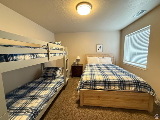 288 W Stuart Dr, Garden City, UT 84028 - carpeted bedroom featuring a textured ceiling and visible vents