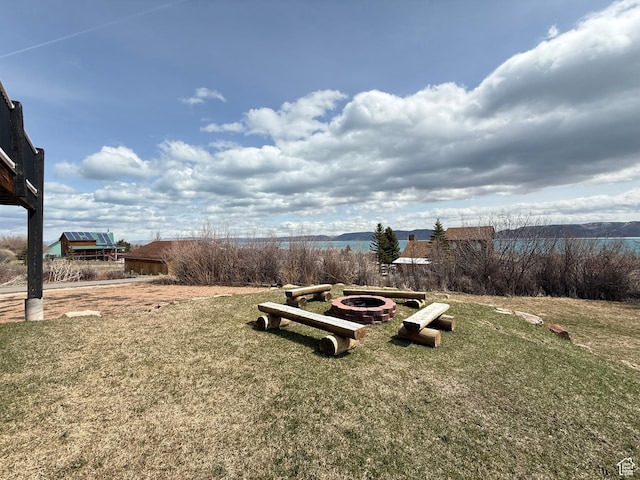 288 W Stuart Dr, Garden City, UT 84028 - view of yard featuring an outdoor fire pit