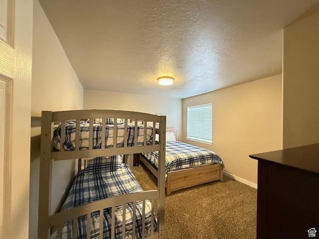 288 W Stuart Dr, Garden City, UT 84028 - carpeted bedroom featuring a textured ceiling and baseboards