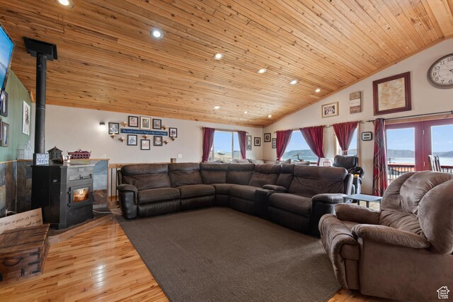 671 W Dee Dr, Garden City, UT 84028 - living room featuring wood ceiling, a wood stove, recessed lighting, and light wood-type flooring