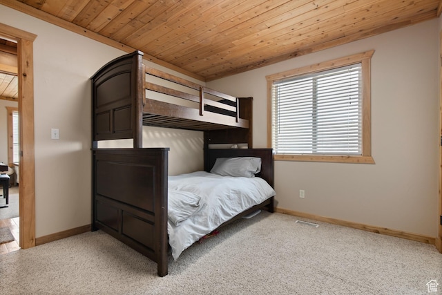 671 W Dee Dr, Garden City, UT 84028 - unfurnished bedroom with visible vents, baseboards, light colored carpet, and wood ceiling