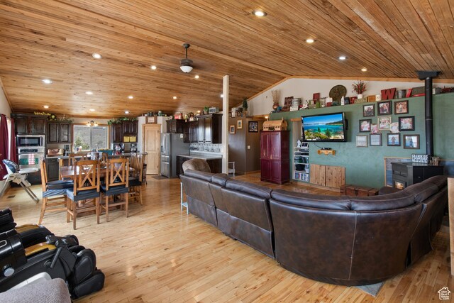 671 W Dee Dr, Garden City, UT 84028 - living area with a wood stove, light wood-style flooring, vaulted ceiling, recessed lighting, and wood ceiling