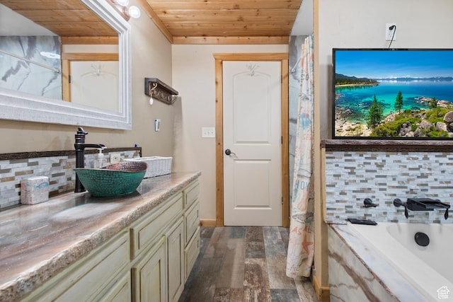 671 W Dee Dr, Garden City, UT 84028 - full bathroom featuring vanity, backsplash, a washtub, wooden ceiling, and wood finished floors