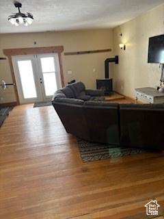 87 N Loafer Canyon Rd, Elk Ridge, UT 84651 - living room with french doors, wood finished floors, and a wood stove