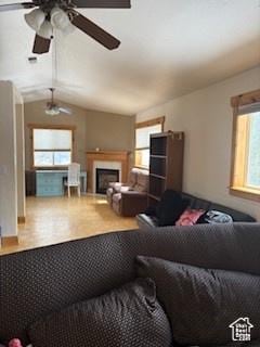 87 N Loafer Canyon Rd, Elk Ridge, UT 84651 - living room featuring a fireplace, ceiling fan, and a healthy amount of sunlight