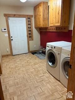 87 N Loafer Canyon Rd, Elk Ridge, UT 84651 - clothes washing area with cabinet space, washer and clothes dryer, and baseboards