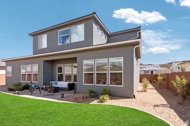 4582 S Sophia Ln, Washington, UT 84780 - rear view of property featuring stucco siding, an outdoor living space, a patio area, a fenced backyard, and a lawn