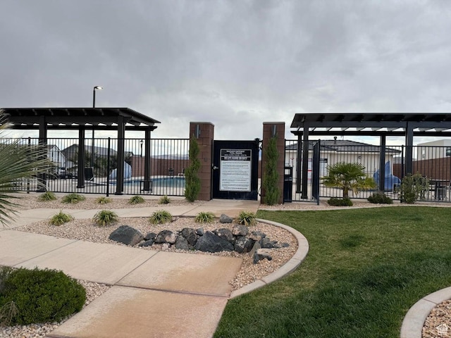 4582 S Sophia Ln, Washington, UT 84780 - surrounding community with fence, a gate, and a lawn
