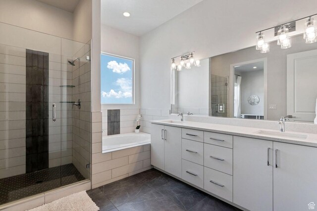 4582 S Sophia Ln, Washington, UT 84780 - full bath featuring a sink, double vanity, a shower stall, marble finish floor, and a garden tub