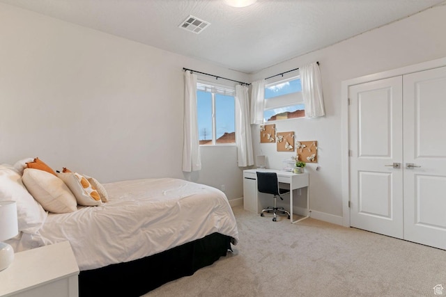 4582 S Sophia Ln, Washington, UT 84780 - bedroom with baseboards, a closet, light carpet, a textured ceiling, and visible vents