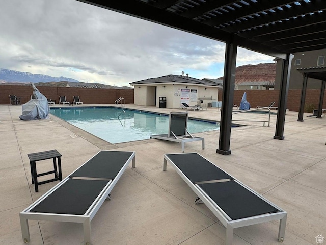 4582 S Sophia Ln, Washington, UT 84780 - pool with a mountain view, a pergola, a fenced backyard, and a patio area