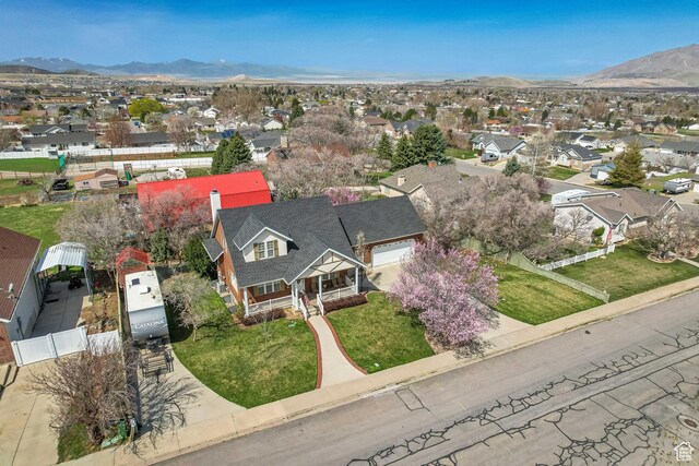drone / aerial view featuring a mountain view and a residential view