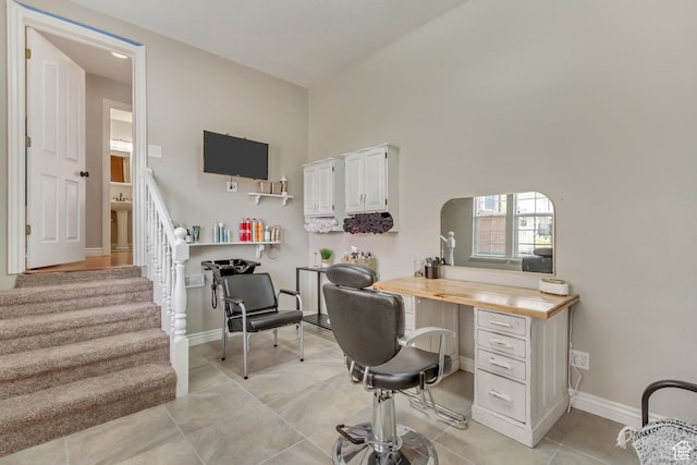 home office featuring baseboards and light tile patterned flooring