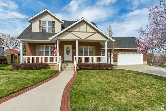 view of front facade featuring a front yard, a porch, a garage, brick siding, and driveway
