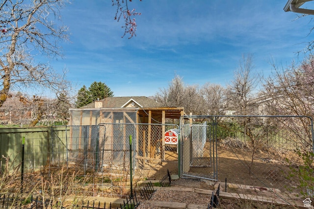 view of yard featuring an outbuilding and a fenced backyard