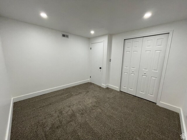 3977 W 5625 S, Roy, UT 84067 - unfurnished bedroom with visible vents, a closet, baseboards, dark carpet, and recessed lighting