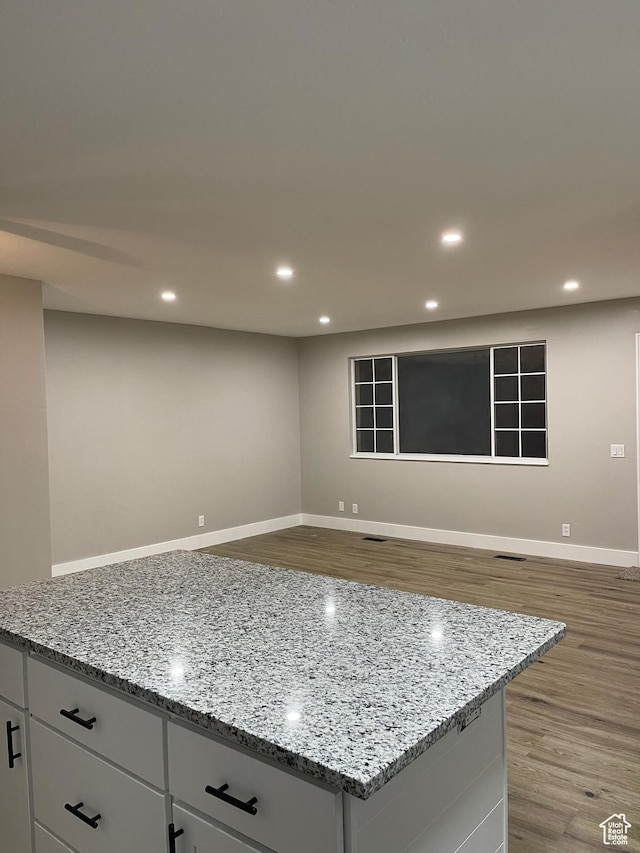 3977 W 5625 S, Roy, UT 84067 - kitchen featuring baseboards, recessed lighting, light stone countertops, and wood finished floors