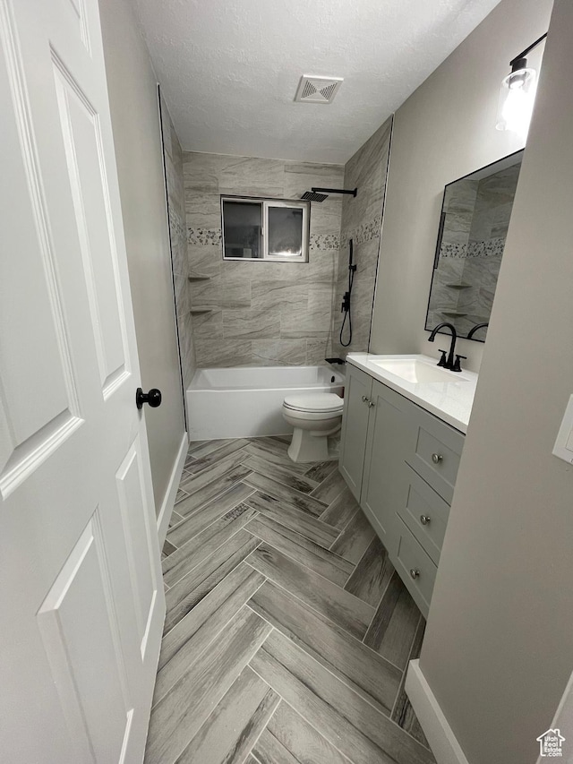 3977 W 5625 S, Roy, UT 84067 - bathroom with visible vents, vanity, toilet, washtub / shower combination, and a textured ceiling
