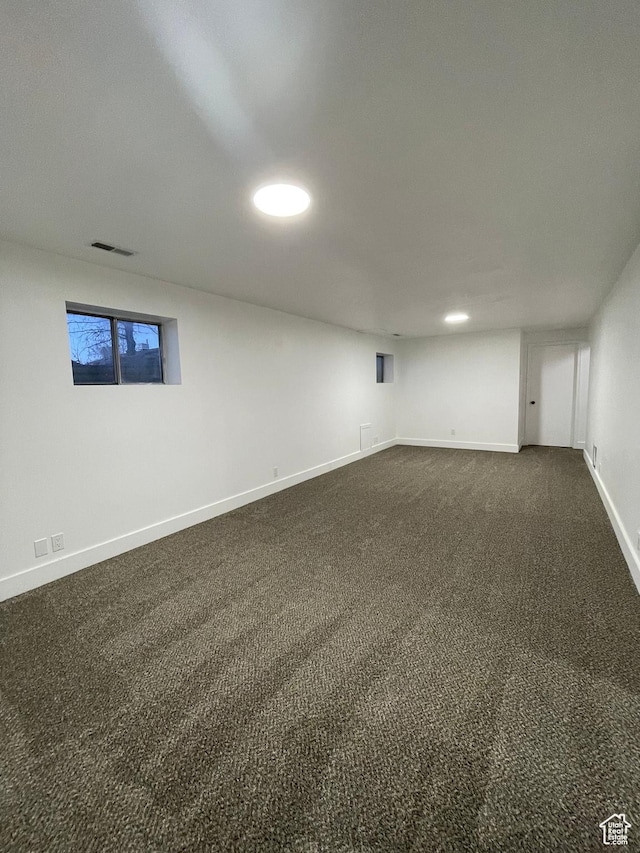 3977 W 5625 S, Roy, UT 84067 - below grade area with dark carpet, baseboards, and visible vents