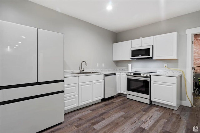393 S Corner View Dr, Tooele, UT 84074 - kitchen featuring stainless steel appliances, a sink, light countertops, white cabinetry, and dark wood-style floors