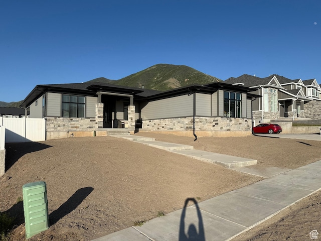 393 S Corner View Dr, Tooele, UT 84074 - prairie-style house featuring stone siding and a mountain view