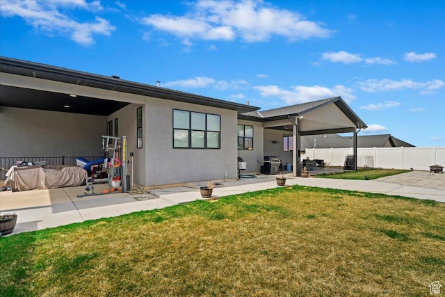 393 S Corner View Dr, Tooele, UT 84074 - back of property with a patio area and stucco siding