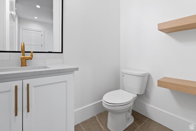 1682 N 2250 W, Provo, UT 84604 - half bathroom with tile patterned flooring, vanity, toilet, baseboards, and recessed lighting