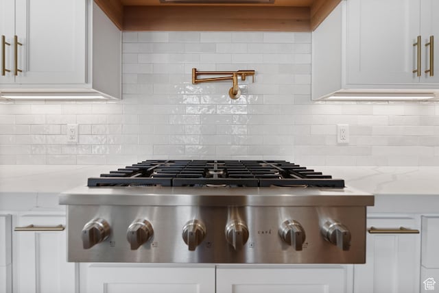 1682 N 2250 W, Provo, UT 84604 - details featuring stainless steel gas cooktop, white cabinetry, and backsplash