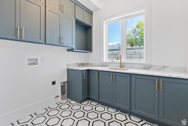1682 N 2250 W, Provo, UT 84604 - clothes washing area with baseboards, electric dryer hookup, a sink, cabinet space, and washer hookup