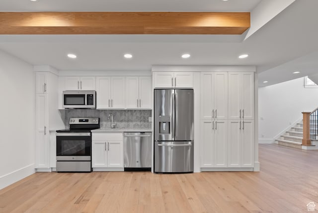 1682 N 2250 W, Provo, UT 84604 - kitchen with baseboards, white cabinetry, and stainless steel appliances