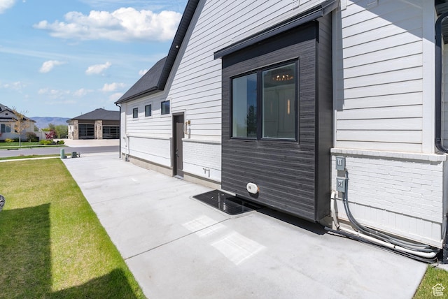 1682 N 2250 W, Provo, UT 84604 - view of side of home with a yard, a patio, and a mountain view