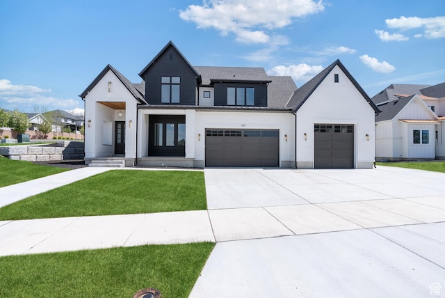 1682 N 2250 W, Provo, UT 84604 - modern farmhouse featuring concrete driveway, a front yard, and a garage