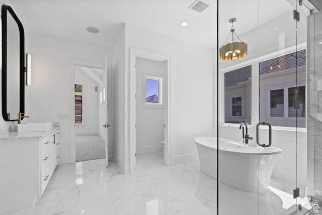 1682 N 2250 W, Provo, UT 84604 - full bathroom featuring visible vents, vanity, marble finish floor, a freestanding tub, and baseboards