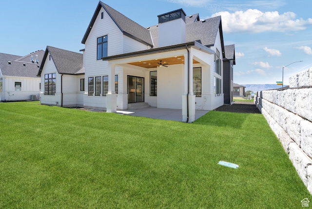 1682 N 2250 W, Provo, UT 84604 - back of property featuring roof with shingles, a patio, ceiling fan, and a lawn