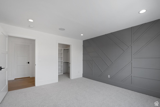 1682 N 2250 W, Provo, UT 84604 - unfurnished bedroom with a decorative wall, carpet flooring, recessed lighting, and a spacious closet