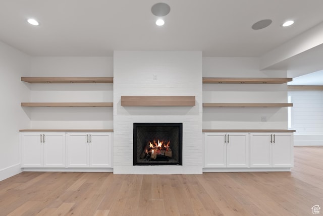 1682 N 2250 W, Provo, UT 84604 - unfurnished living room with recessed lighting, a fireplace, and light wood finished floors