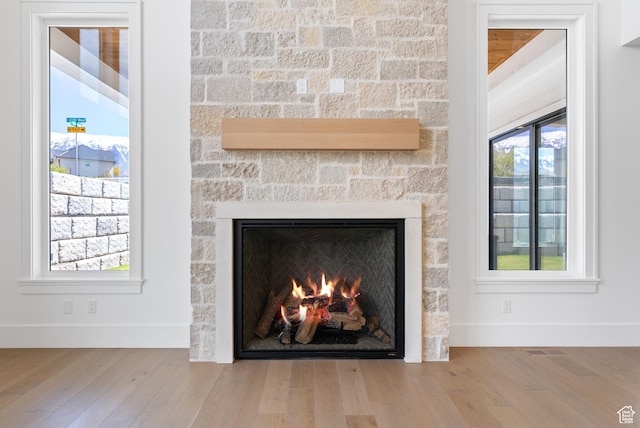 1682 N 2250 W, Provo, UT 84604 - details featuring baseboards, visible vents, wood finished floors, and a fireplace