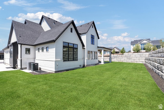 1682 N 2250 W, Provo, UT 84604 - rear view of house with a yard, a fenced backyard, and roof with shingles