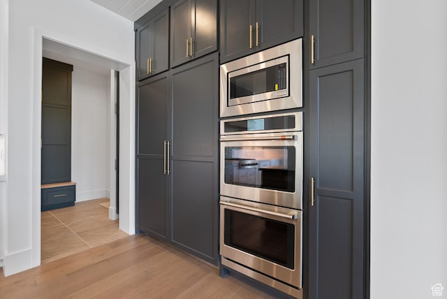 1682 N 2250 W, Provo, UT 84604 - kitchen featuring baseboards, light wood-style flooring, and stainless steel appliances