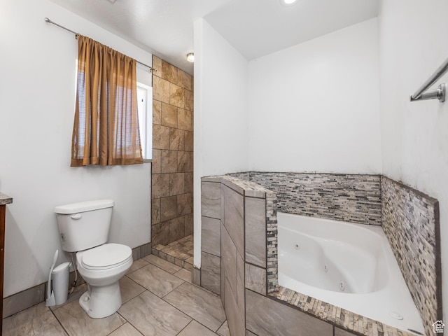 8915 E 33550 N, Fairview, UT 84629 - bathroom featuring toilet, a jetted tub, baseboards, and a tile shower